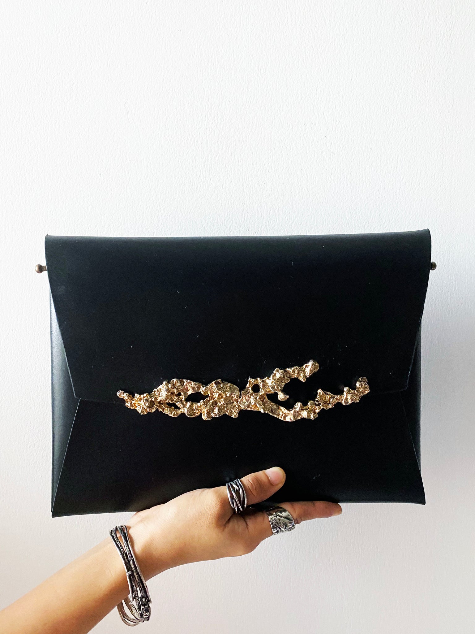 studio metallurgy coral clutch  leather