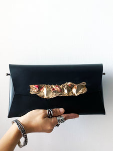 studio metallurgy coral clutch  